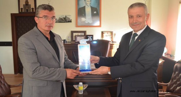 AKSARAY SGİM'DENBORCU OLMAYAN BELEDİYEYE PLAKET